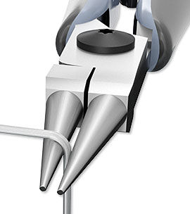 Wire being bent with round-nose pliers.
